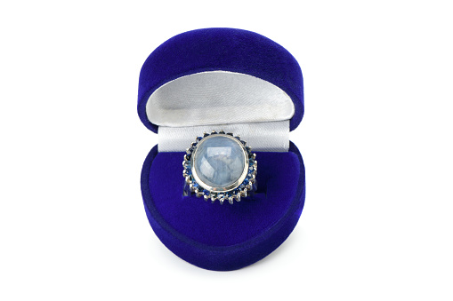 Ring with star blue sapphire isolated on a white background. Gemstones of Sri Lanka.