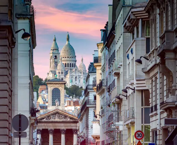 Sacre Coeur Basilica on top of the Montmartre hill at sunset. Paris. France.