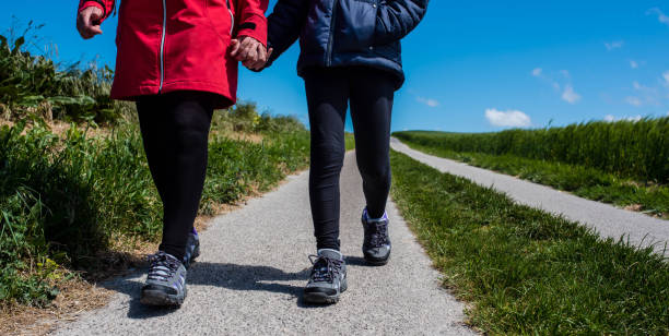 istock mom and little daughter on the paths 1224849917