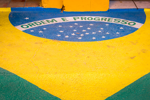 Brazilian flag painted on the floor of the street side walk in Salvador, Bahia - Brazil