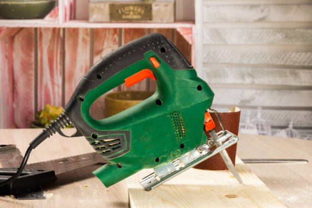 Electric jigsaw and various carpenter tools. stock photo