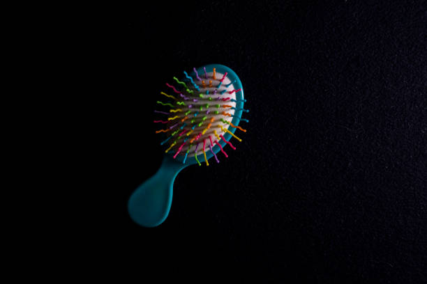 istock Massage comb on a dark textile. Flat lay and copy s 1224851368