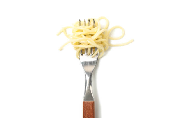 istock Fork with tasty pasta isolated on white background 1224851884