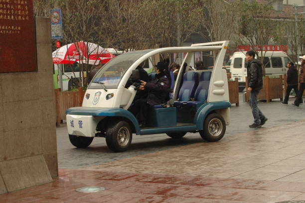 Trieste, Italy - October 11, 2024: Package Delivery Yellow Electric Cargo Vehicle Italian Post Parked at Street in City.