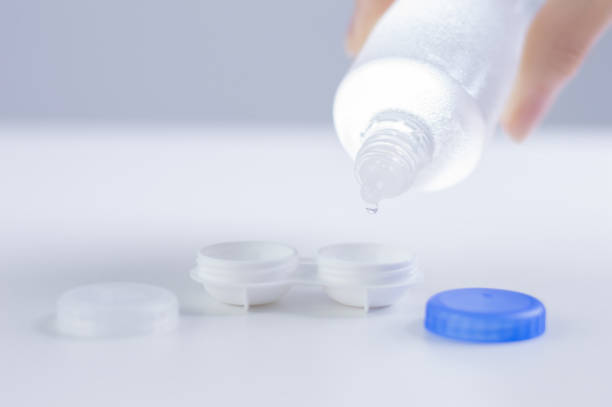 istock Liquid for lenses is poured into the boxes. Ophthalmology concept. White background. 1224853201