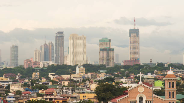 Manila skyscrapers in the cloudy evening. Philippines