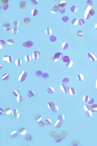 istock Pearl confetti on blue background. 1224855326
