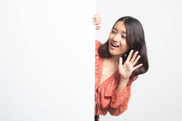 istock Excited young Asian woman with blank sign . 1224855393