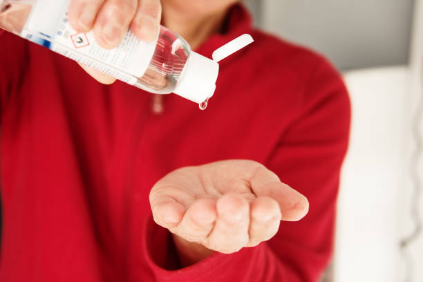 istock Disinfecting hands with hand sanitizer 1224855967