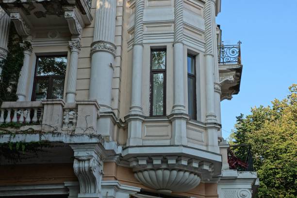istock old brown concrete wall of a historic building with white columns 1224856239