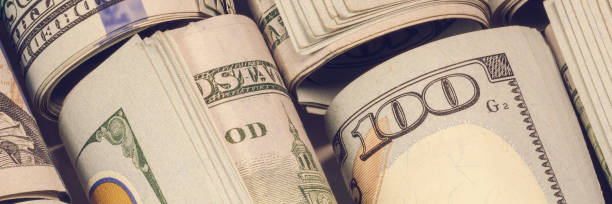 istock money hundred dollars with rubber band panorama 1224856337