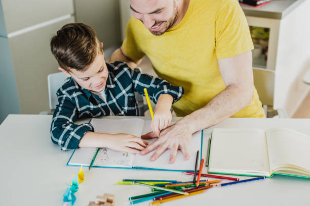 istock Young father takes an active role in his son's education 1224858290