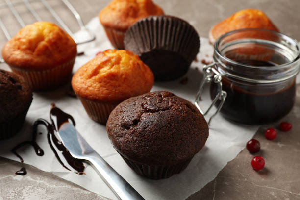 istock Composition with delicious muffins, berries, chocolate and baking paper 1224859670