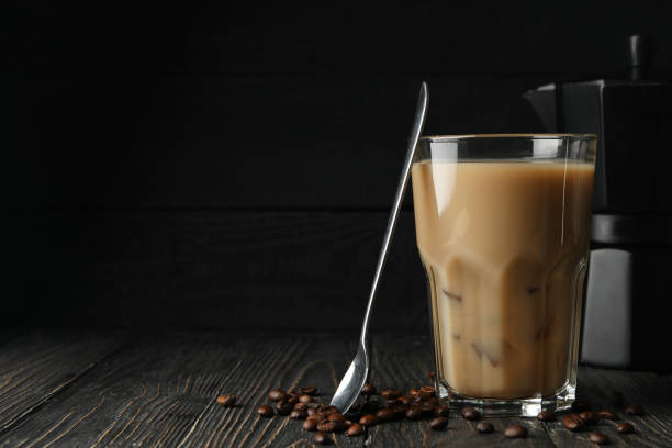 istock Composition with ice coffee and coffee seeds on wooden background 1224862740