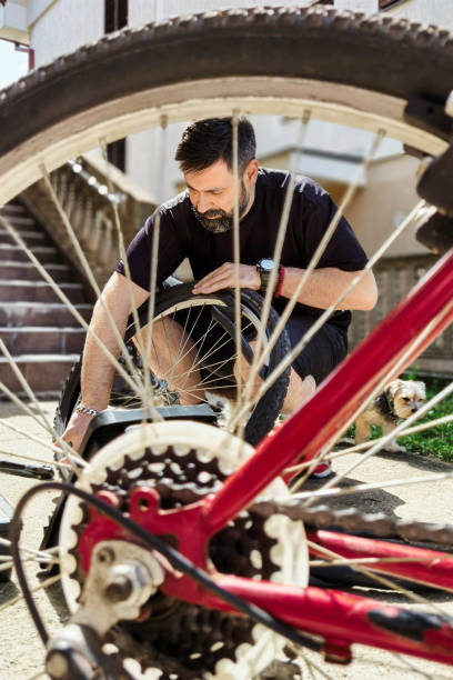 istock Man repairing bicycle DIY 1224863146