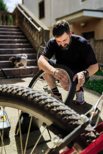 istock Man repairing bicycle DIY 1224864158