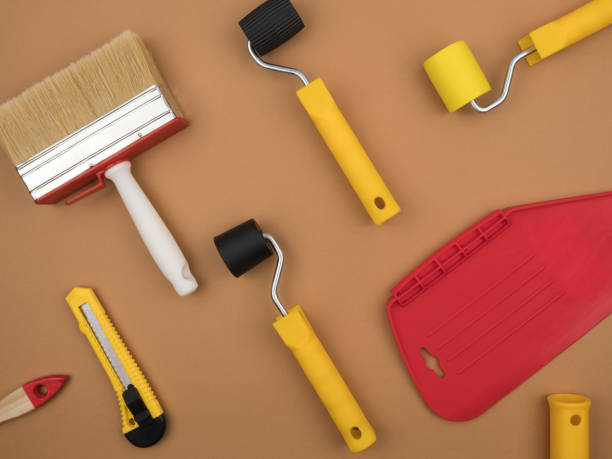 istock A paint tool for wallpapering. Beige background. 1224865851