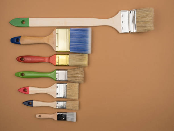 istock Different brushes for painting on a beige background. 1224865981