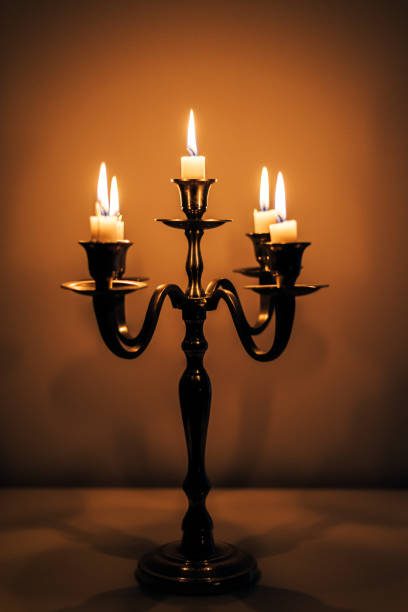 istock Burning candles on table in darkness 1224868777