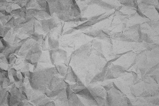 istock Crumpled recycled paper. Black and white background image. 1224869998