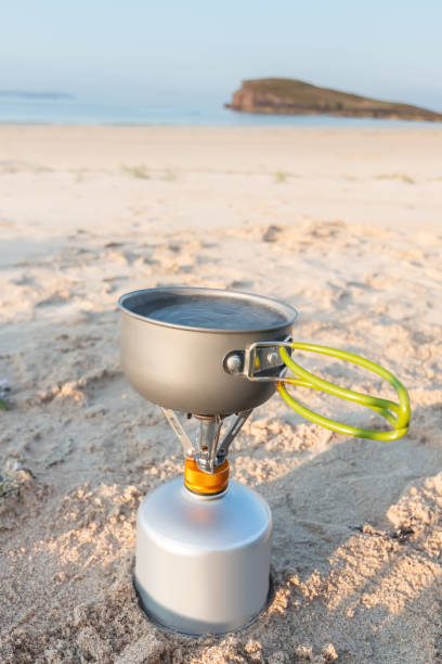 istock Boiling water on a portable camping stove an the beach 1224871968
