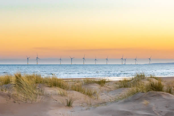 Offshore windfarm Offshore windfarm with sand dunes in the foreground aberdeen scotland stock pictures, royalty-free photos & images
