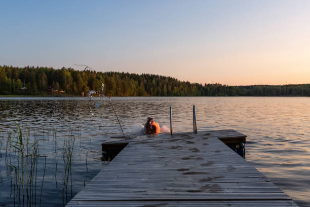 istock Swimming after sauna, summer evening in Finland 1224882246
