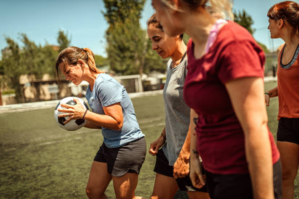 istock Female soccer players on field 1224883993
