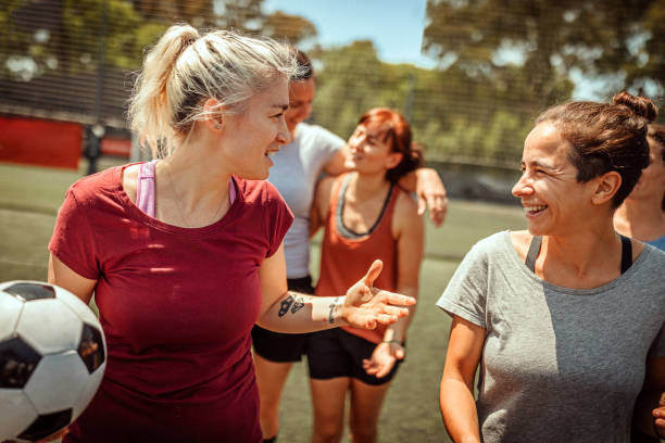 istock Female soccer team talking on field 1224884779