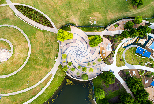 aerial drone views looking straight down from above Austin , Texas , USA - Circling and patterns with Spiral designs and Modern Playground Public Park