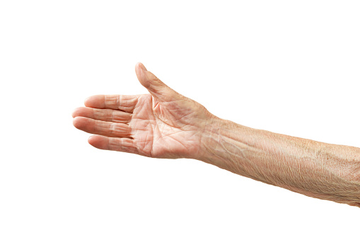 Old lady's hand with open palm. Elderly lady is waiting for help. Elderly, Aging concept. White background. Isolated, close up, overhead, copy space