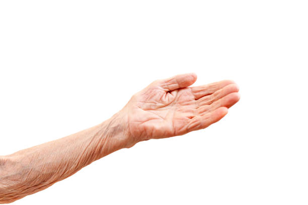 istock Old lady's hand with open palm. Elderly lady is waiting for help. Elderly, Aging concept. White background. Isolated. Close up, copy space. 1224885874
