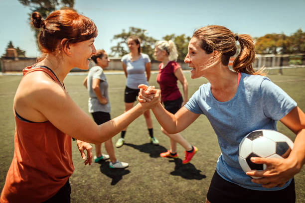 istock Two women soccer players shaking hands 1224887029