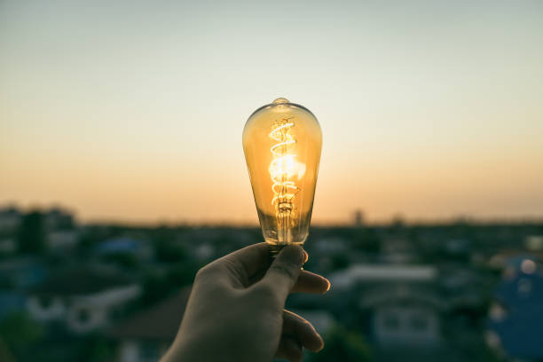 istock Hand business man holding light bulb.Alternative energy, idea, saving electricity innovation and inspiration concepts. 1224887032