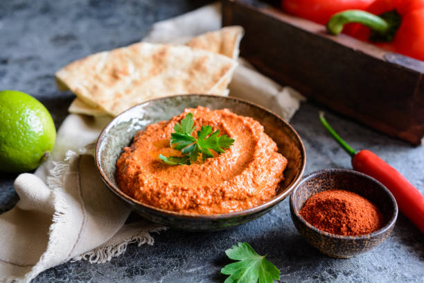 istock Muhammara, healthy walnut and roasted red bell pepper dip served with flatbread 1224887158