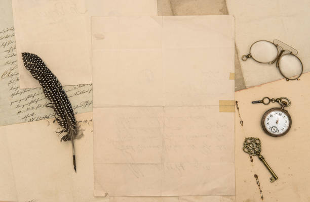 istock Old paper feather pen vintage accessories flat lay background 1224887668