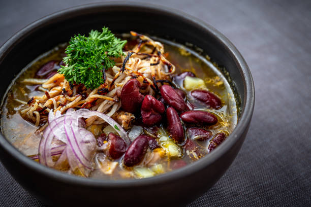 istock Bean soup with smoked pork, potatoes, herbs, onion 1224888282