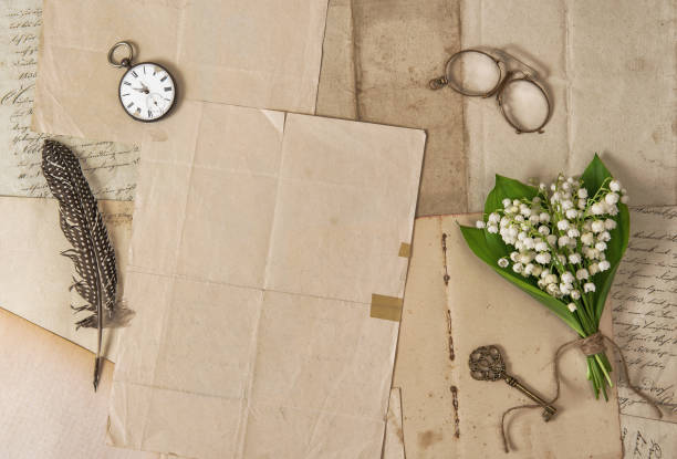 istock Old paper feather pen vintage accessories spring flowers Nostalgic background 1224888324
