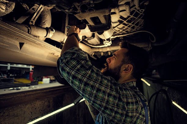 istock Car Mechanic working below a truck 1224888809