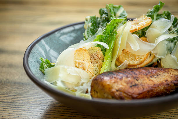 istock Roman lettuce salad with grilled chicken breast 1224889398
