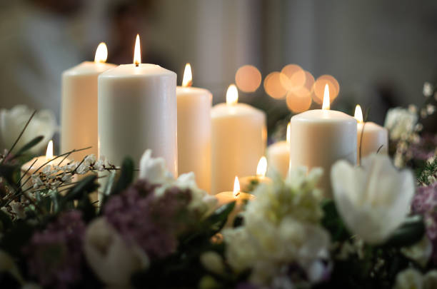 White candles lit in church