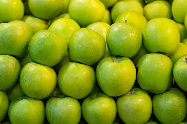 Close up green apples background