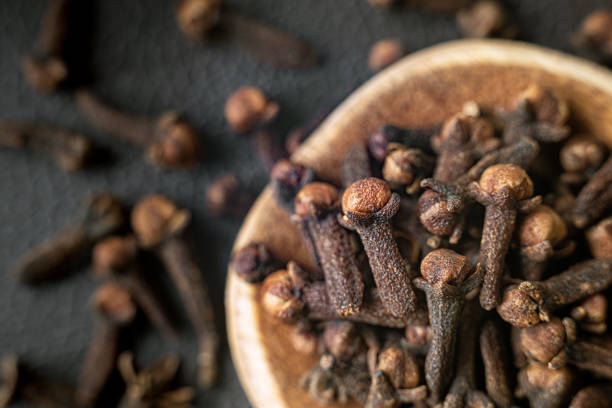 istock Top view spice clove in a wooden spoon. 1224895578