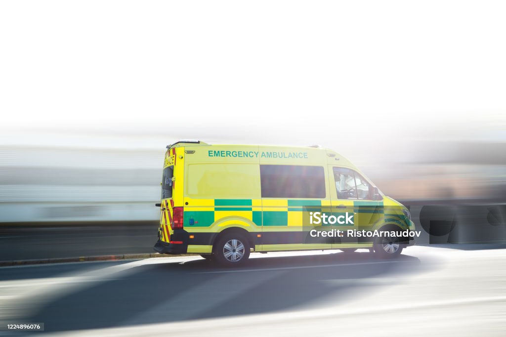 Ambulance UK respond to an Emergency in downtown Ambulance respond to an Emergency in downtown in UK, United Kingdom Ambulance Stock Photo