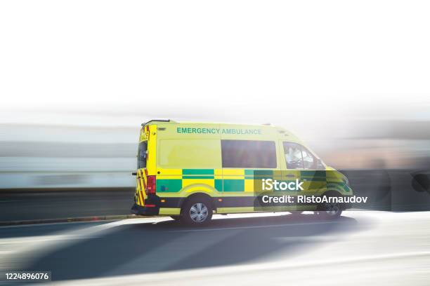 Ambulance Uk Respond To An Emergency In Downtown Stock Photo - Download Image Now - Ambulance, UK, Accidents and Disasters