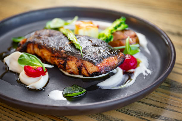 istock Grilled fish fillet with vegetables, white puree 1224896687