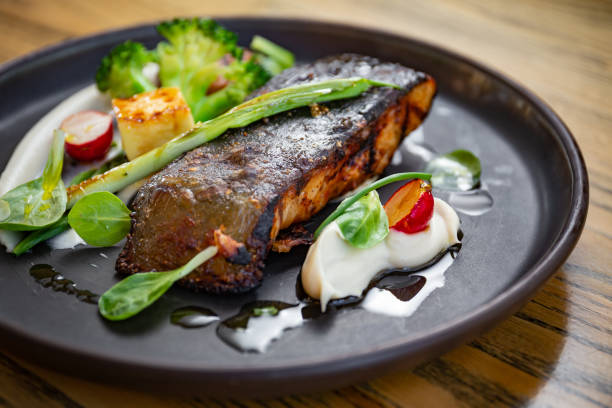 istock Grilled fish fillet with vegetables, white puree 1224896761
