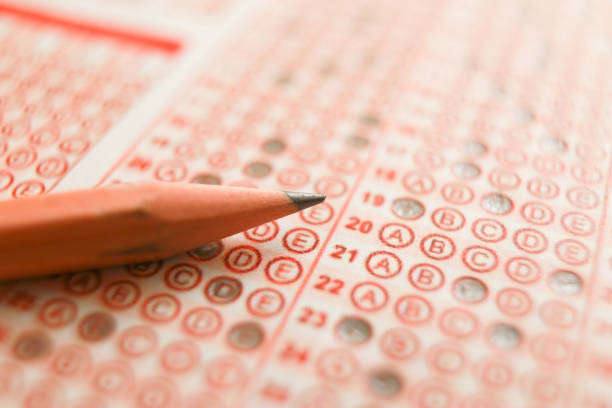 istock Answer sheet with pencil and eraser. close up 1224901352