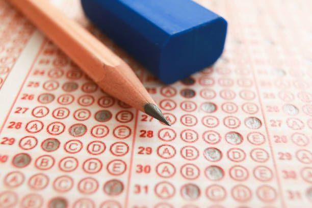 istock Answer sheet with pencil and eraser. close up 1224901383