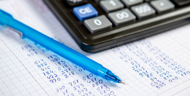 istock Pen and calculator. Background Items for doing business in the office in the composition. 1224902572
